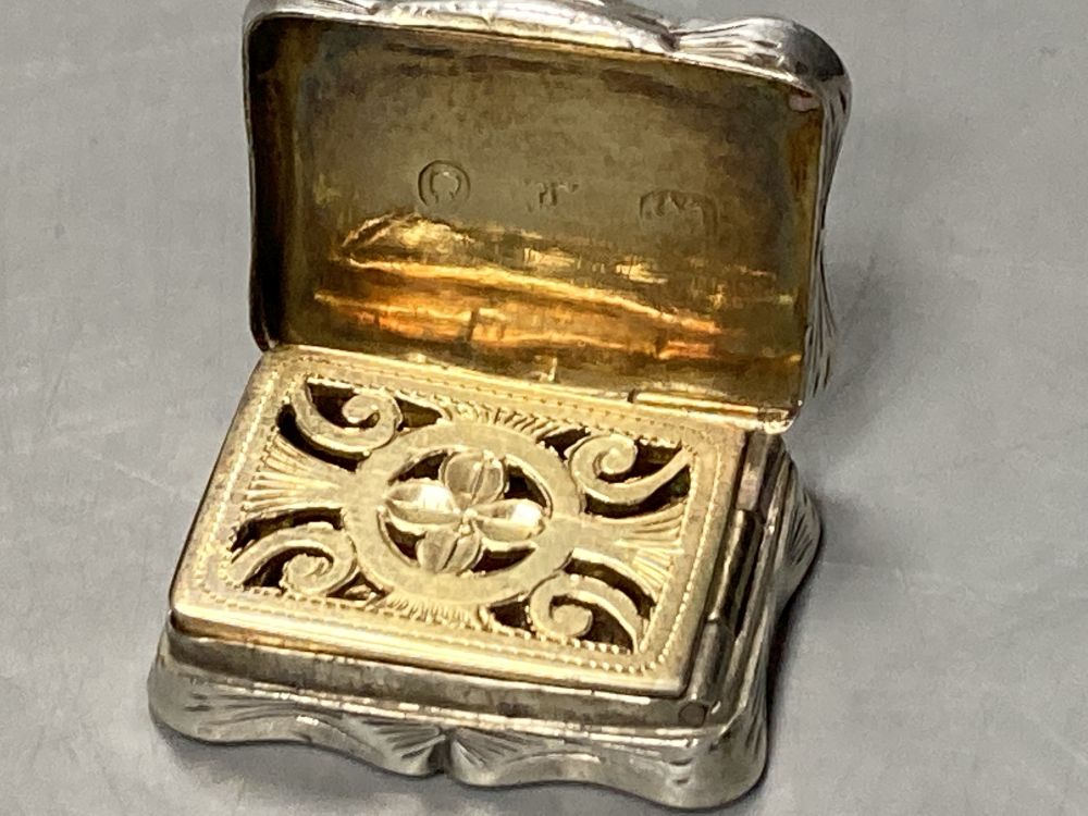 A Victorian engine turned silver vinaigrette, makers mark rubbed, Birmingham, 1858, 27mm.